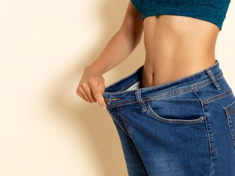 front-view-young-female-with-fit-body-shirt-jeans-white-wall-2048x1365